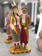 Hand-painted wooden couple figurine from Ukraine, symbolizing unity and tradition, ideal wedding or 5th anniversary gift.