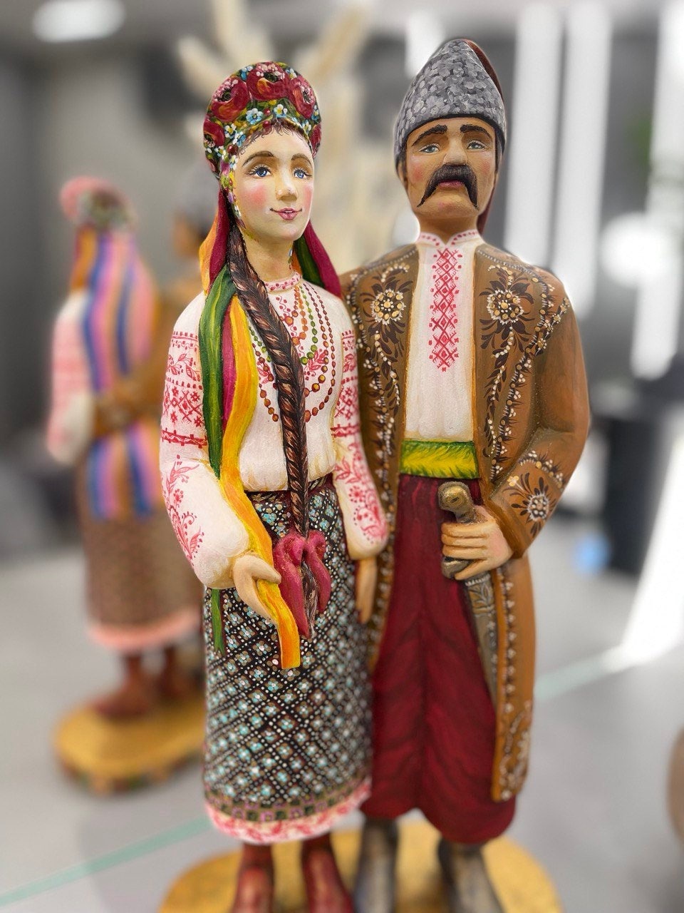 Hand-painted wooden couple figurine, traditional Ukrainian attire, perfect for wedding or 5th anniversary gift, 35 cm tall.
