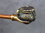Handcrafted bronze pipe with Ukrainian trident, featuring unique artisan details and cultural symbolism.