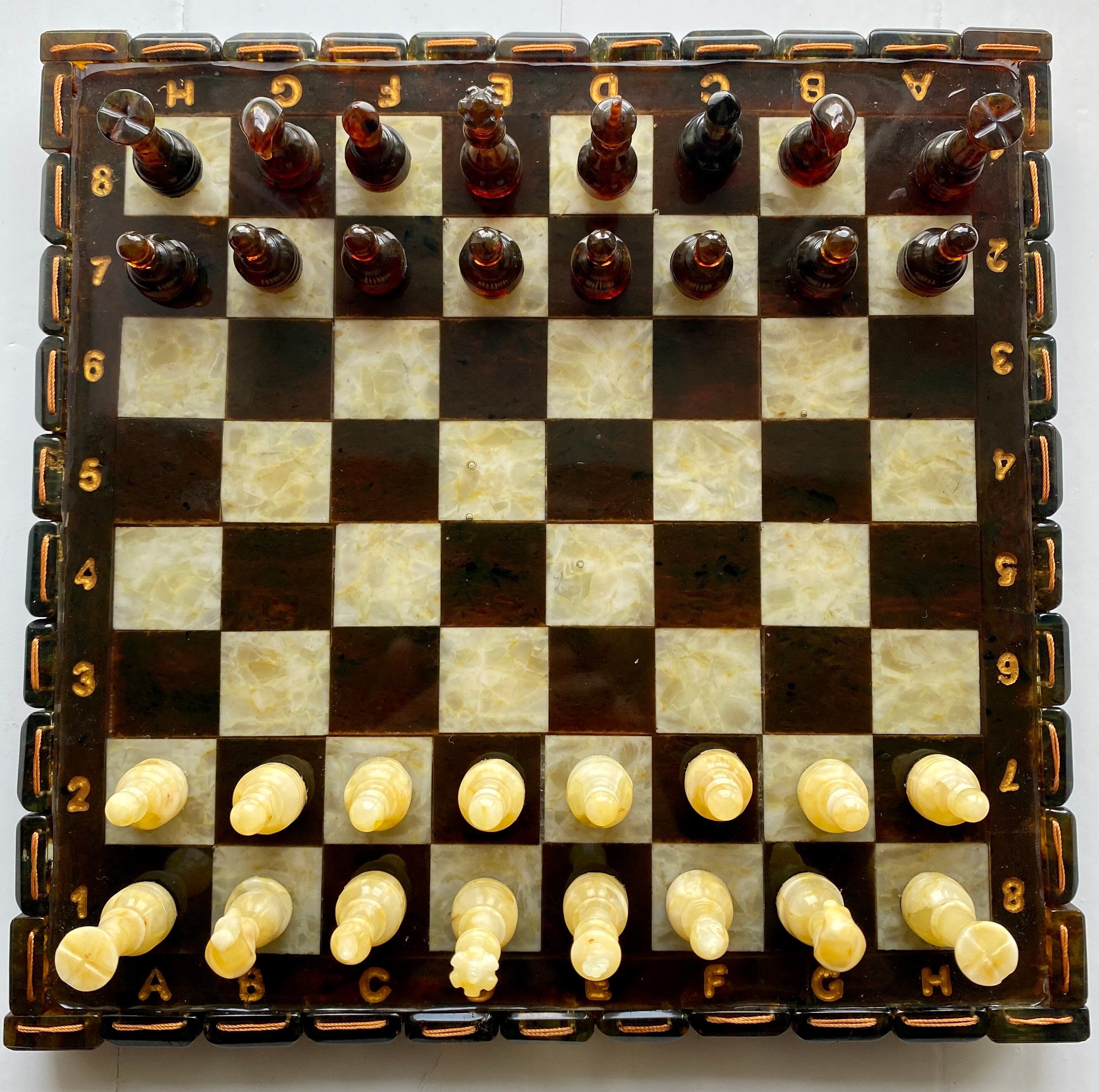 Handcrafted Baltic amber chess set with elegant amber-inlaid board, perfect for collectors and chess enthusiasts.