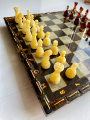 Handcrafted Baltic amber chess set with elegant amber-inlaid board, showcasing exquisite natural amber chess pieces for collectors.