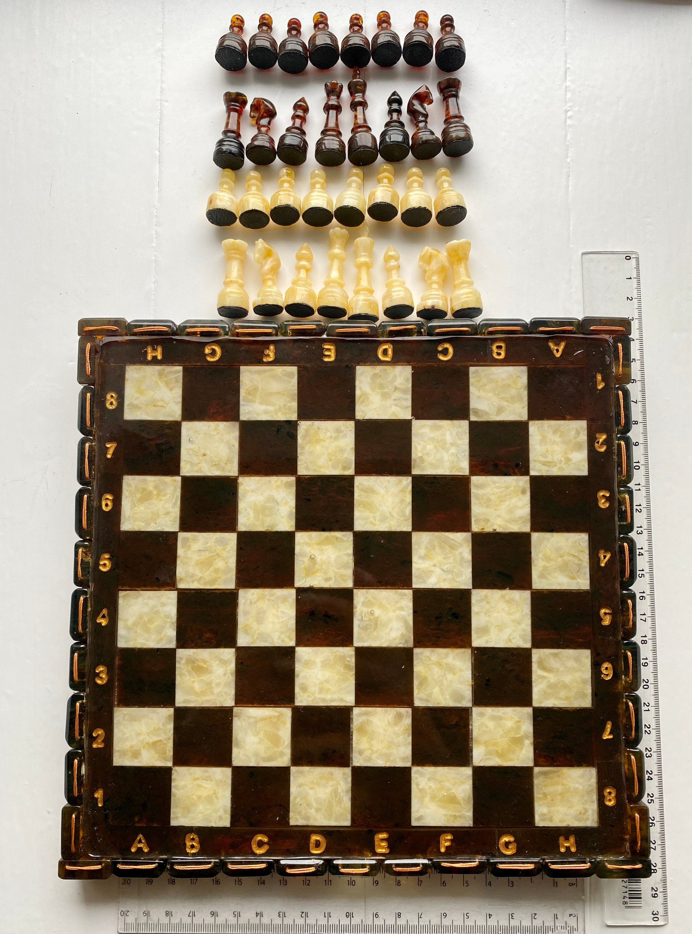 Handcrafted Baltic amber chess set with elegant amber-inlaid board, perfect for collectors and chess enthusiasts.