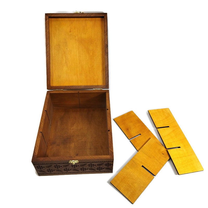 Handcrafted wooden tea box with Ukrainian trident design, featuring removable dividers. Perfect as an elegant gift or decorative piece.