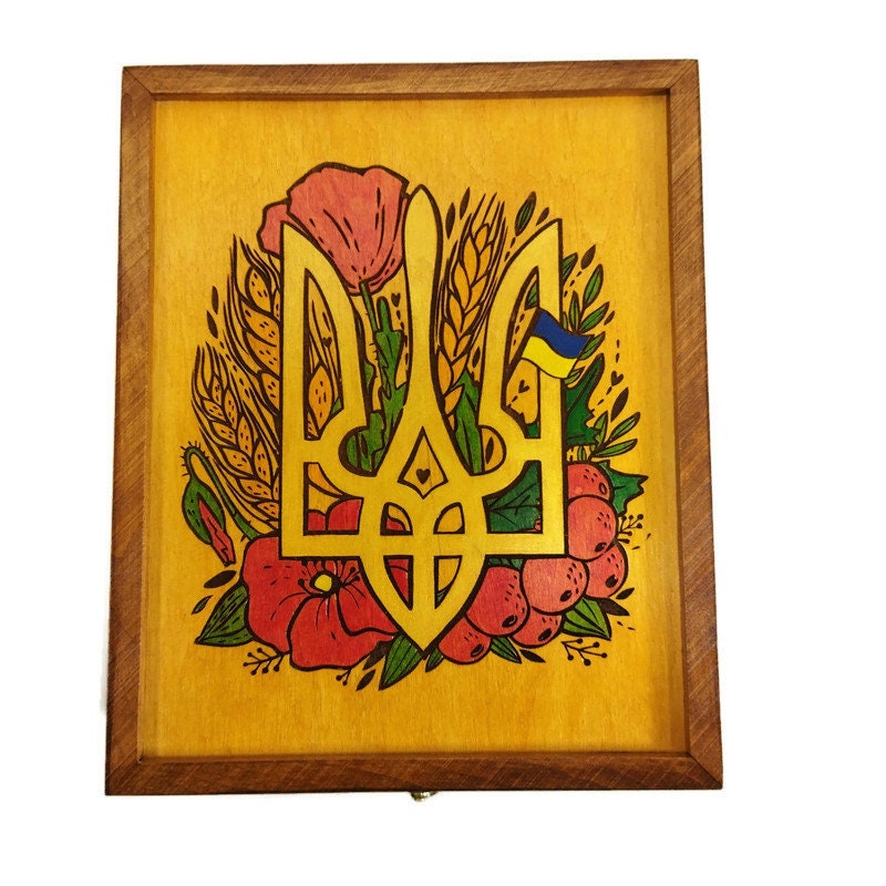 Handcrafted wooden tea box with Ukrainian trident engraving, featuring traditional embroidery style design. Elegant gift from Ukraine.