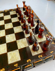 Handcrafted Baltic amber chess set with elegant board and amber-inlaid pieces, perfect for collectors and chess enthusiasts.