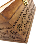 Handcrafted wooden tea box with Ukrainian embroidered-style engraving, featuring the national trident emblem.