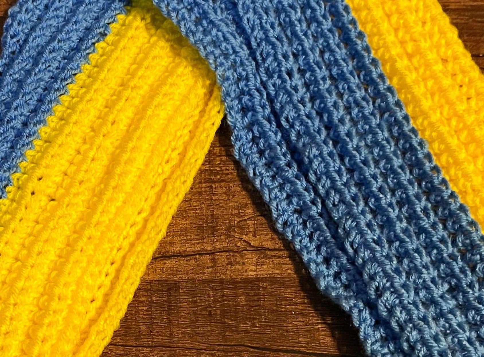 Handmade blue and yellow crochet scarf inspired by Ukrainian flag, perfect winter accessory to show support for Ukraine.
