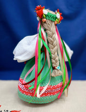 Handmade Ukrainian Motanka Doll with colorful ribbons, representing a traditional Slavic talisman for prosperity and protection.