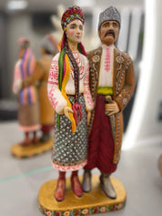Hand-painted wooden couple figurine from Ukraine, symbolizing unity and tradition, perfect for weddings or 5th anniversary gifts.