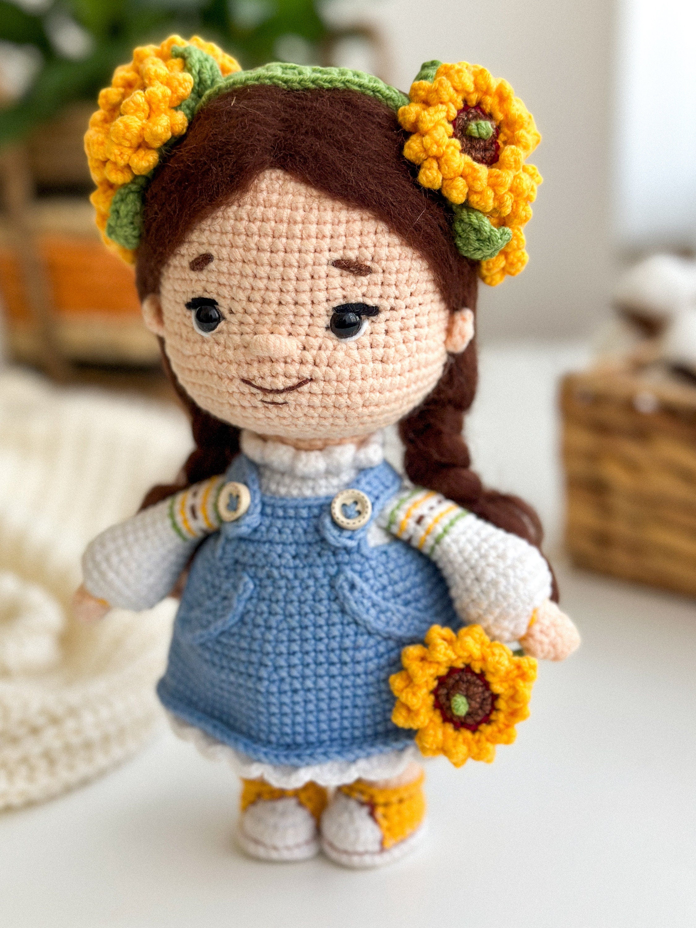 Handmade knitted doll with sunflowers, soft Ukrainian themed toy, blue dress, perfect cultural keepsake gift for kids and adults.
