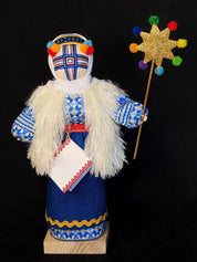 Handmade Motanka Doll 'Christmas' with fur vest and star wand on wooden stand, symbolizing Ukrainian heritage and home protection.