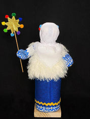 Handmade Ukrainian Motanka "Christmas" doll on wooden stand, symbolizes protection and heritage, crafted with love.