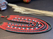 Handmade red and green Ukrainian necklace with ceramic beads, ethnic jewelry, perfect for traditional outfits and gifts.