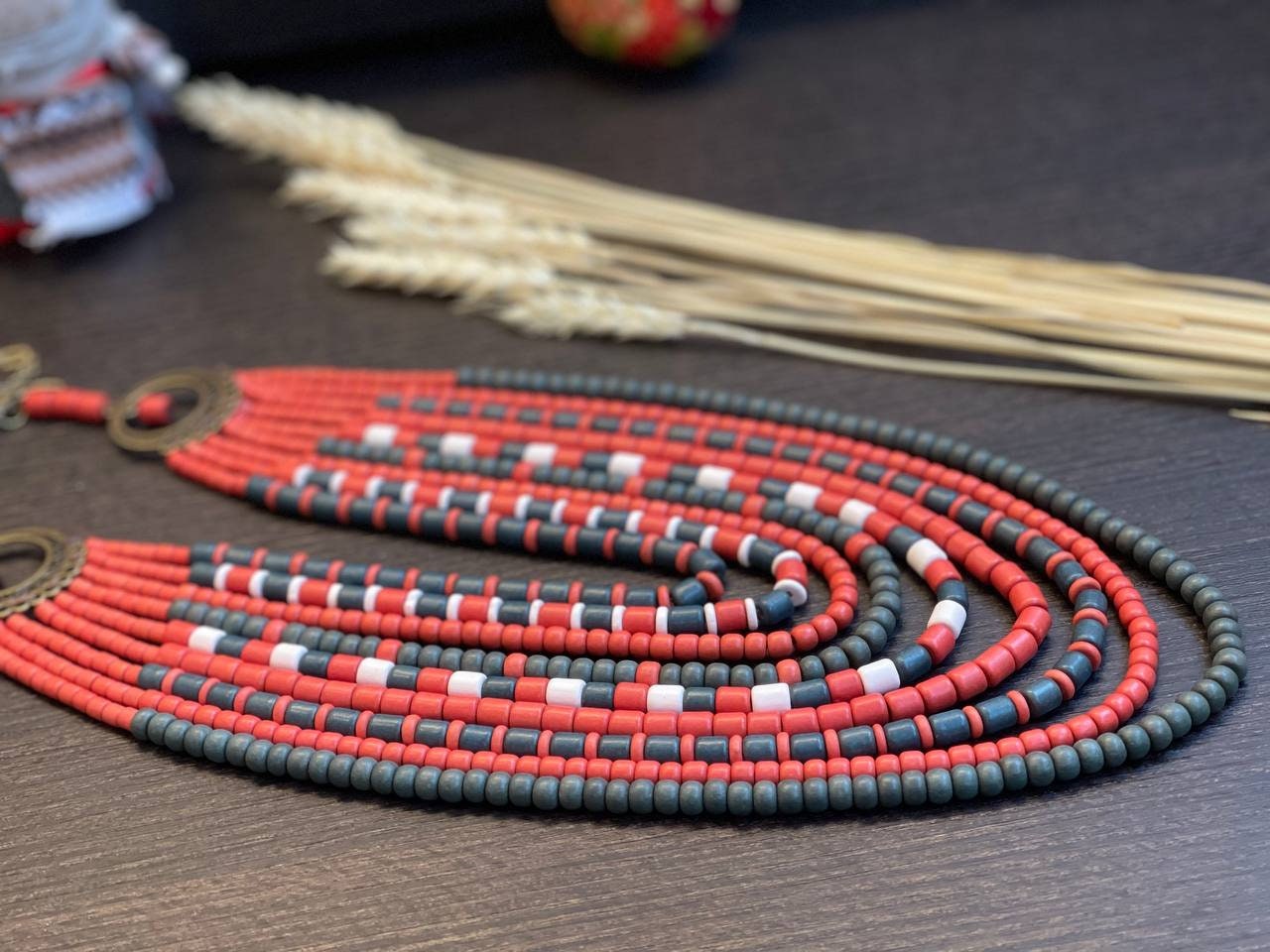 Handmade red and green Ukrainian necklace with ceramic beads, ethnic jewelry, perfect for traditional outfits and gifts.