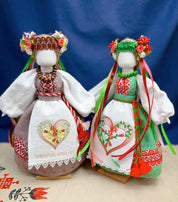 Handmade Ukrainian Motanka dolls, traditional Slavic talismans, featuring vibrant dresses and floral headpieces for home protection.