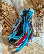 Handmade Ethnic Motanka Doll with Colorful Ribbons and Floral Details, a Symbol of Wisdom and Protection in Home Decor