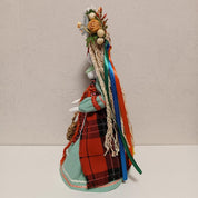 Handmade Ukrainian Motanka Doll with colorful dress and flower headdress, side view, 28 cm, unique cultural decor and gift.