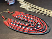 Handmade red and green Ukrainian ceramic necklace, ethnic jewelry, traditional gift for her, displaying vibrant folk artistry.