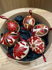 Set of 6 handmade Ukrainian Pysanky with red patterns, traditional Easter art on real chicken eggs, ideal Christmas gift.