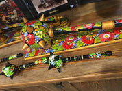 Handmade wooden Ukrainian Bulava maces with vibrant floral designs, showcasing traditional craftsmanship and national heritage.