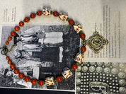 Ukrainian handmade necklace with white clay and jasper beads, displayed on traditional background, inspired by nature and culture.