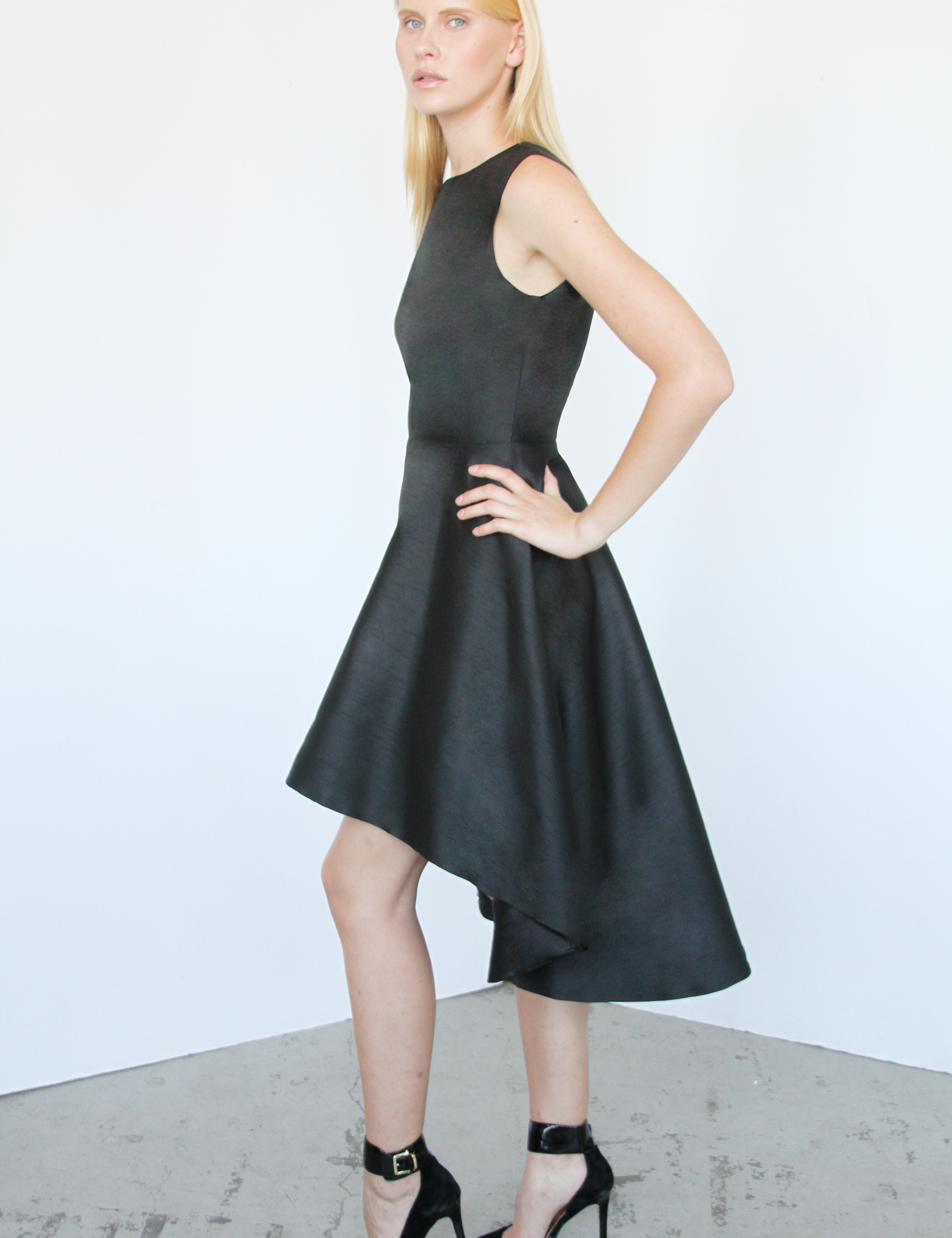 Woman wearing the Irvelle Hi-Lo Gala Dress in black with a high-low hem, perfect for upscale dinners and events.