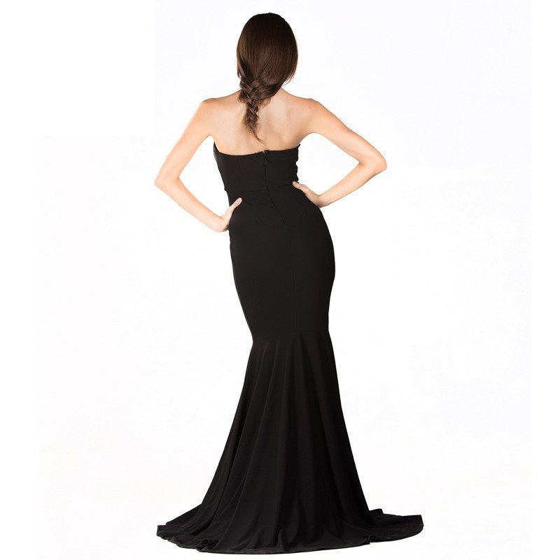 Elegant black mermaid gown with a flared train, perfect for formal events or parties, highlighting an elongated silhouette and fitted bodice.