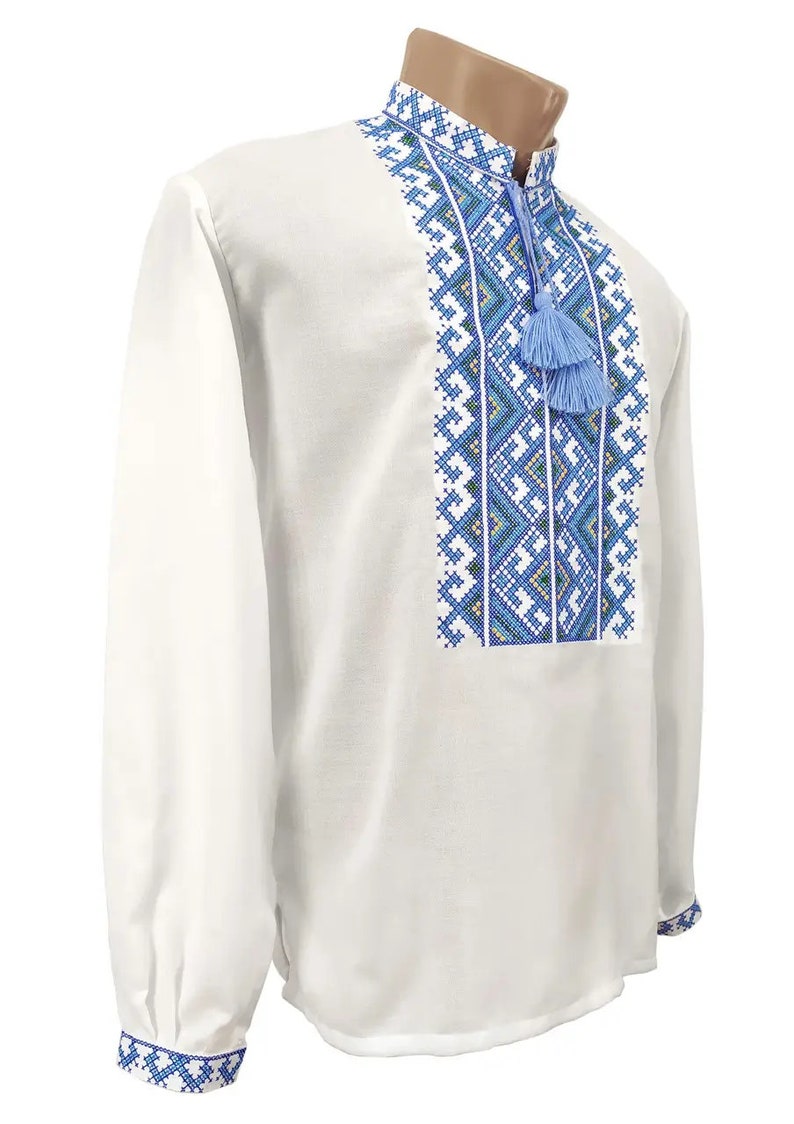 Men's embroidered Vyshyvanka shirt with blue geometric patterns, long sleeves, and adjustable neck straps.