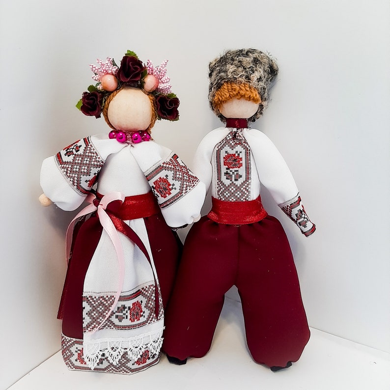 Handcrafted Ukrainian Motanka dolls in traditional embroidered clothing, symbolizing cultural heritage and national pride.