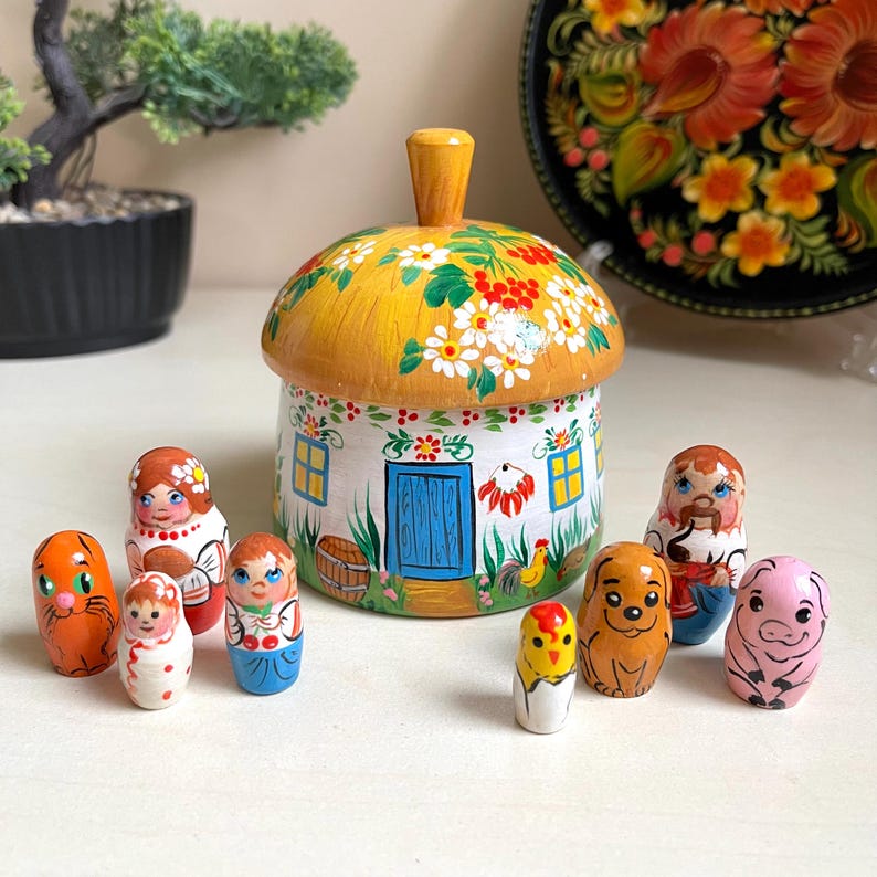 Ukrainian wooden house set with hand-painted family dolls and ethnic decorations, perfect for kids' room decor and gifts.