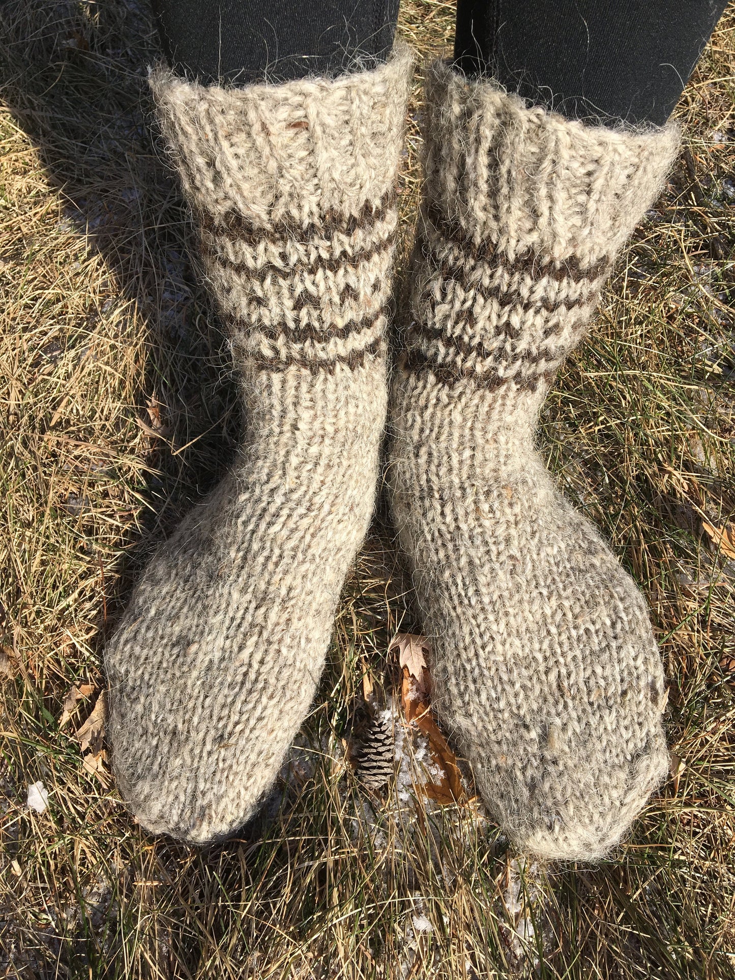 Hand-knitted wool socks made from 100% organic sheep wool for men and women, perfect for winter warmth and comfort.