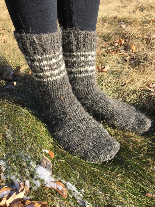 Hand-knitted unisex wool socks made from pure sheep wool, perfect for winter warmth and comfort.