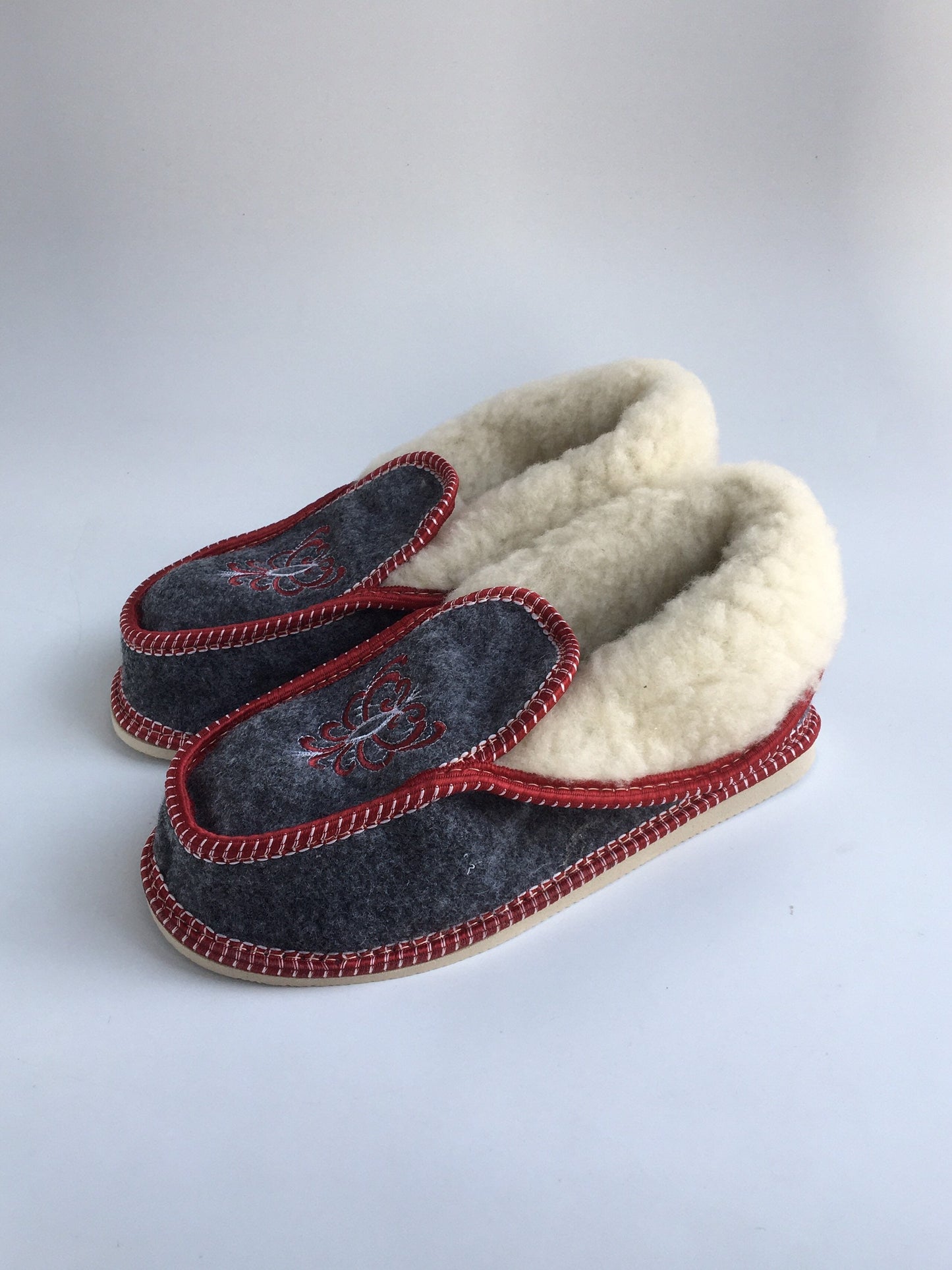 Handmade Carpathian wool slippers with Hutsul embroidery in gray and red, cozy Ukrainian Christmas gift.