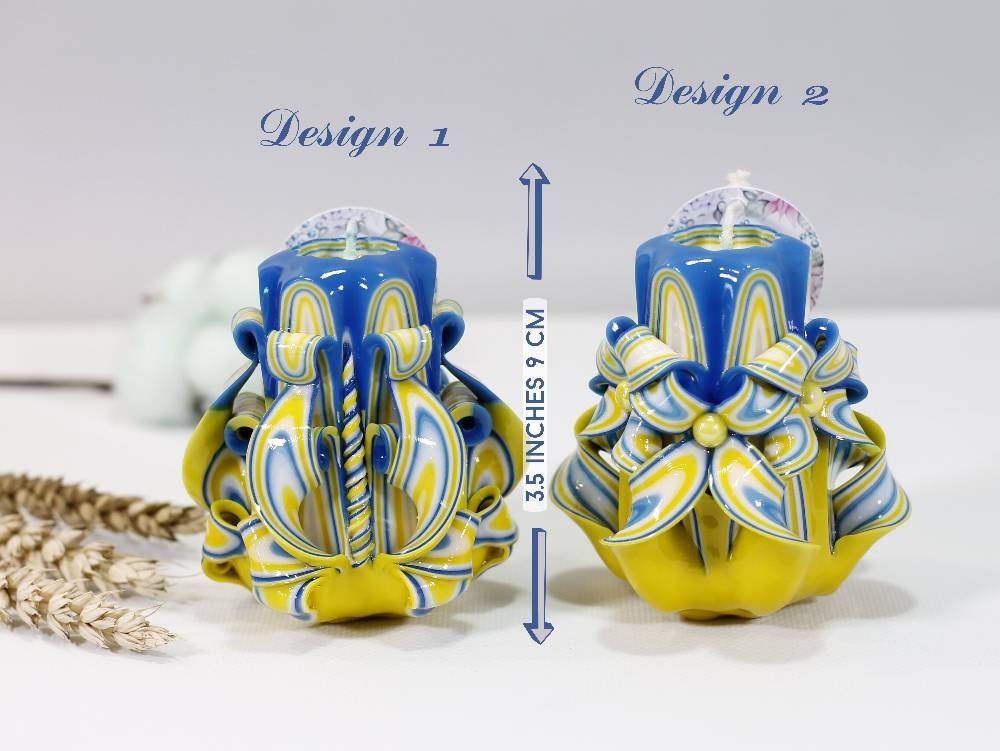 Handcrafted blue and yellow carved candle designs supporting Ukraine, symbolizing hope and resilience.