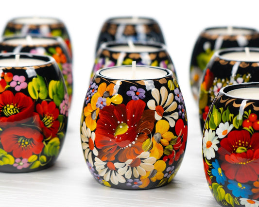 Hand-painted Ukrainian tea light candle holders with Petrykivka floral designs, showcasing vibrant traditional patterns.