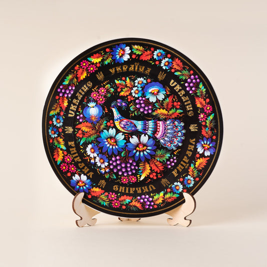 Ukrainian porcelain plate with vibrant Petrykivsky floral pattern, 20cm wall art on wooden stand.