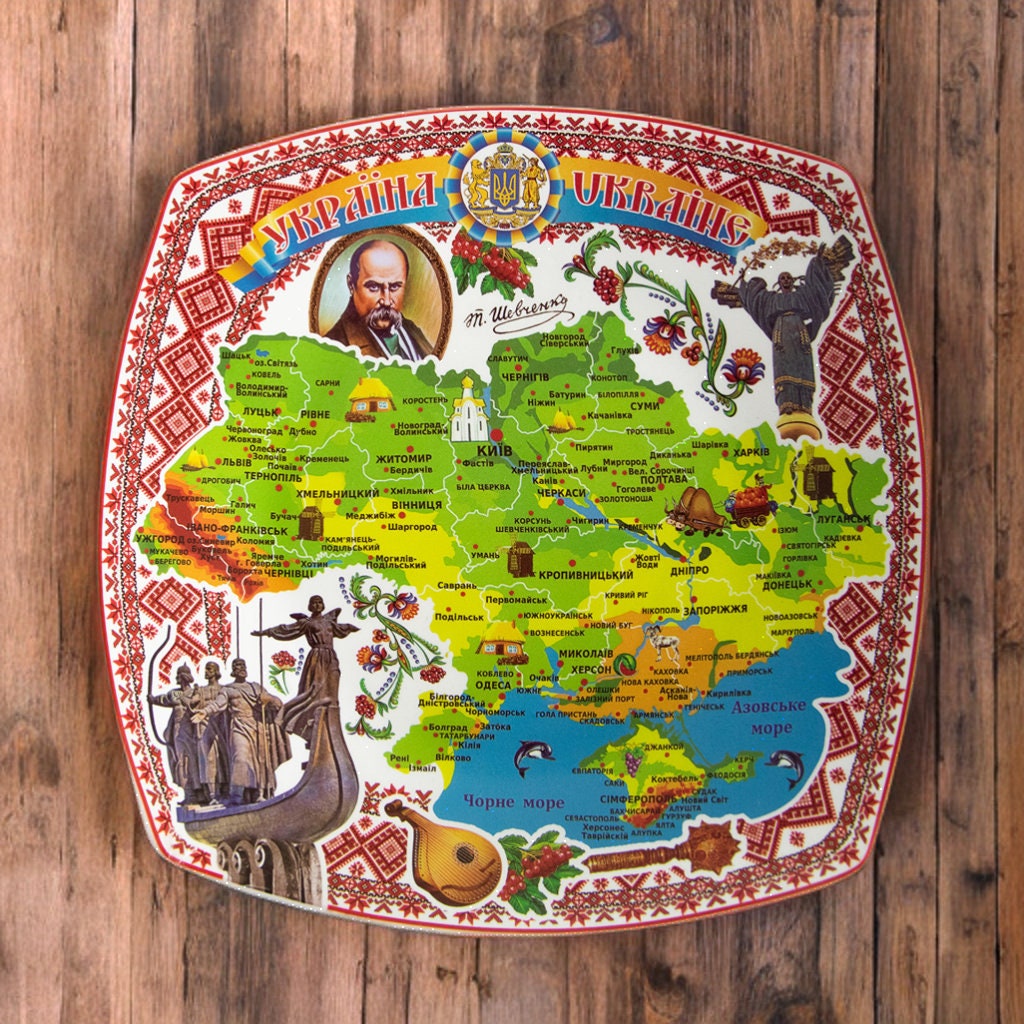 Ukrainian souvenir plate with a map decal and Taras Shevchenko portrait, handmade decorative pottery for display and home decor.