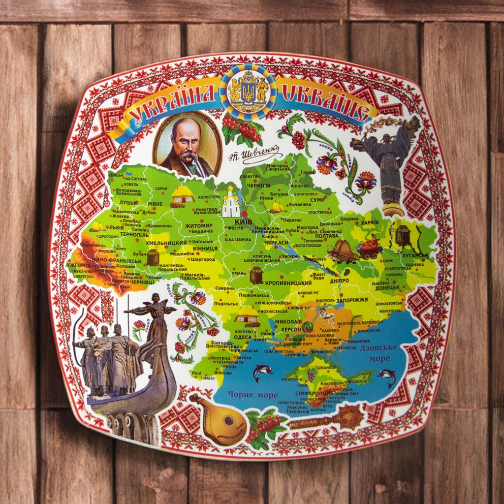 Ukrainian souvenir plate with map and Taras Shevchenko portrait, handmade decorative pottery for display and home decor.