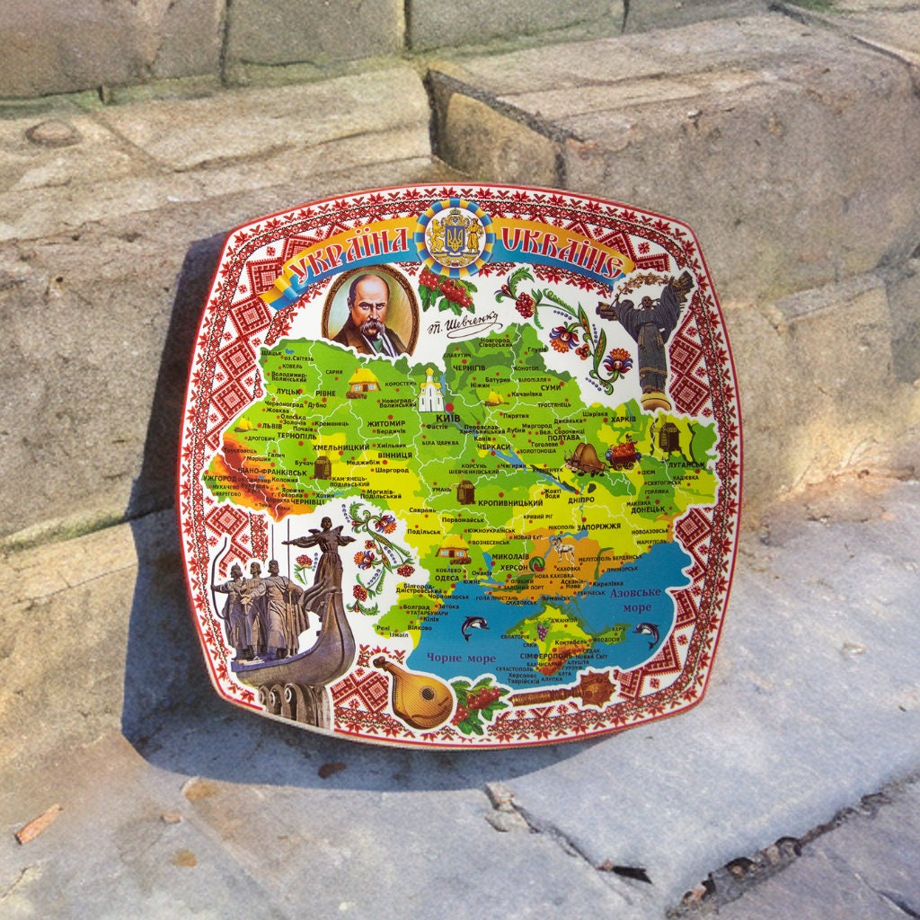 Ukrainian souvenir plate with vibrant map and Taras Shevchenko portrait, handmade ceramic for display, ideal for decor.