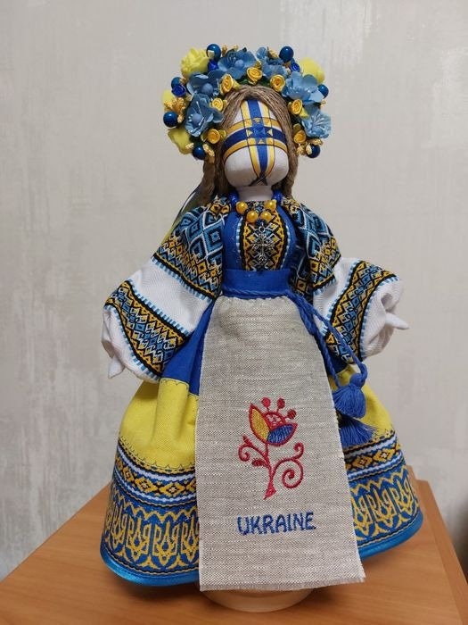 Handmade Ukrainian Motanka Doll "Beregynya" with hand embroidery in blue and yellow, symbolizing home protection and heritage.