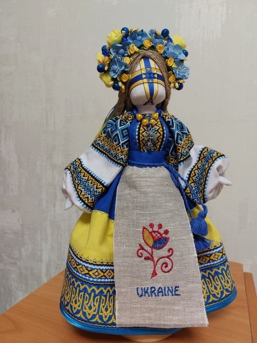 Handmade Ukrainian Motanka Doll "Beregynya" with blue and yellow embroidery, symbolizing protection and heritage.