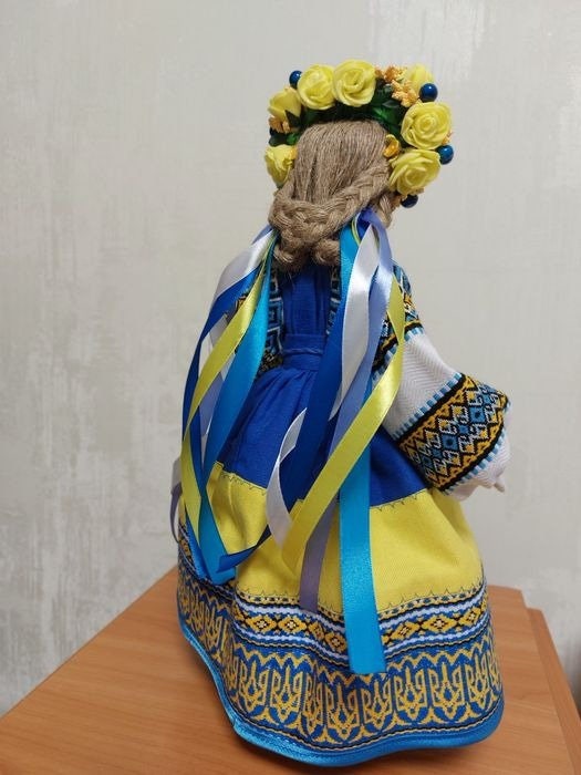 Handmade Ukrainian Motanka Doll with colorful embroidery and ribbons, symbolizing protection and heritage.