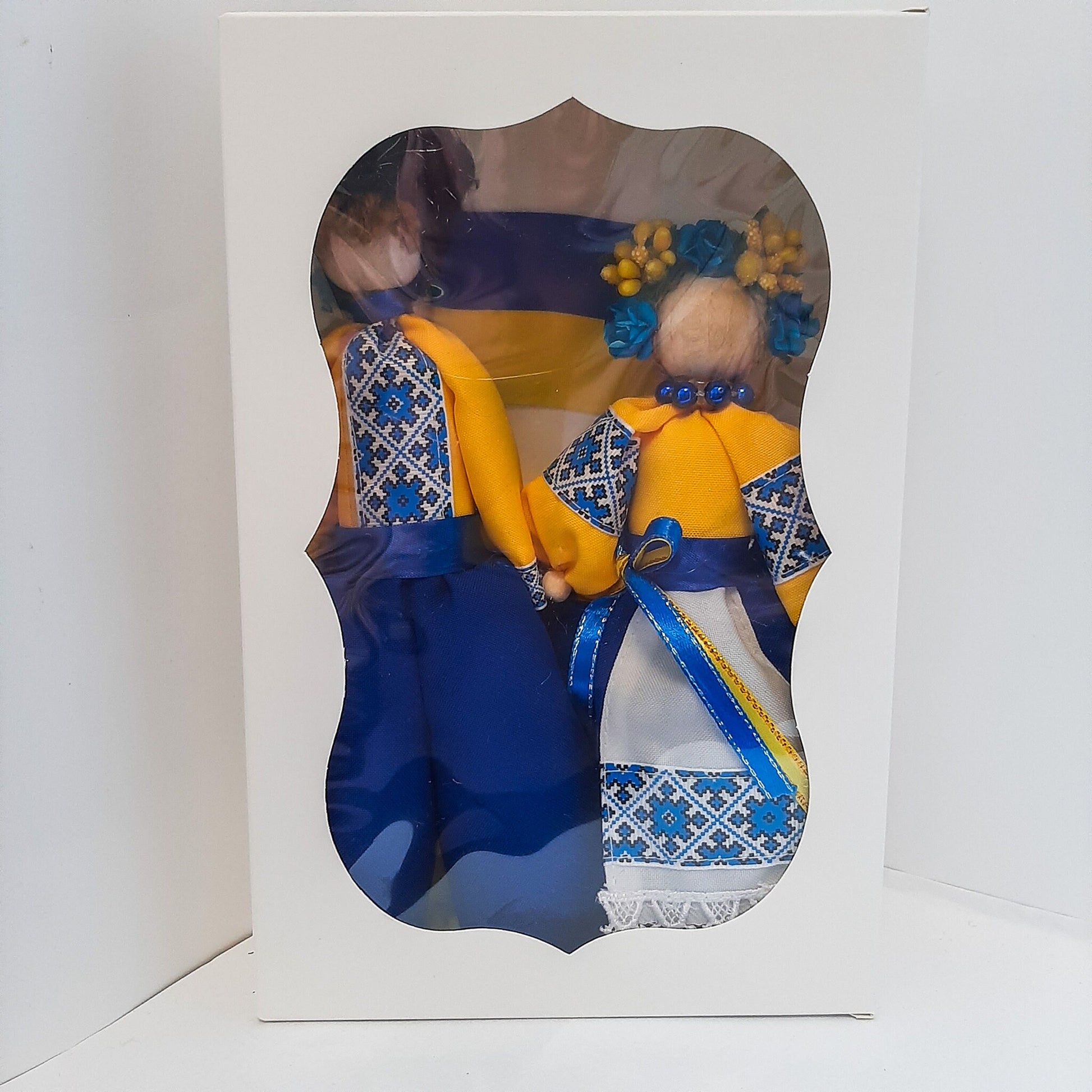 Ukrainian folk dolls in national clothes, featuring blue and yellow colors, packaged in a decorative box.