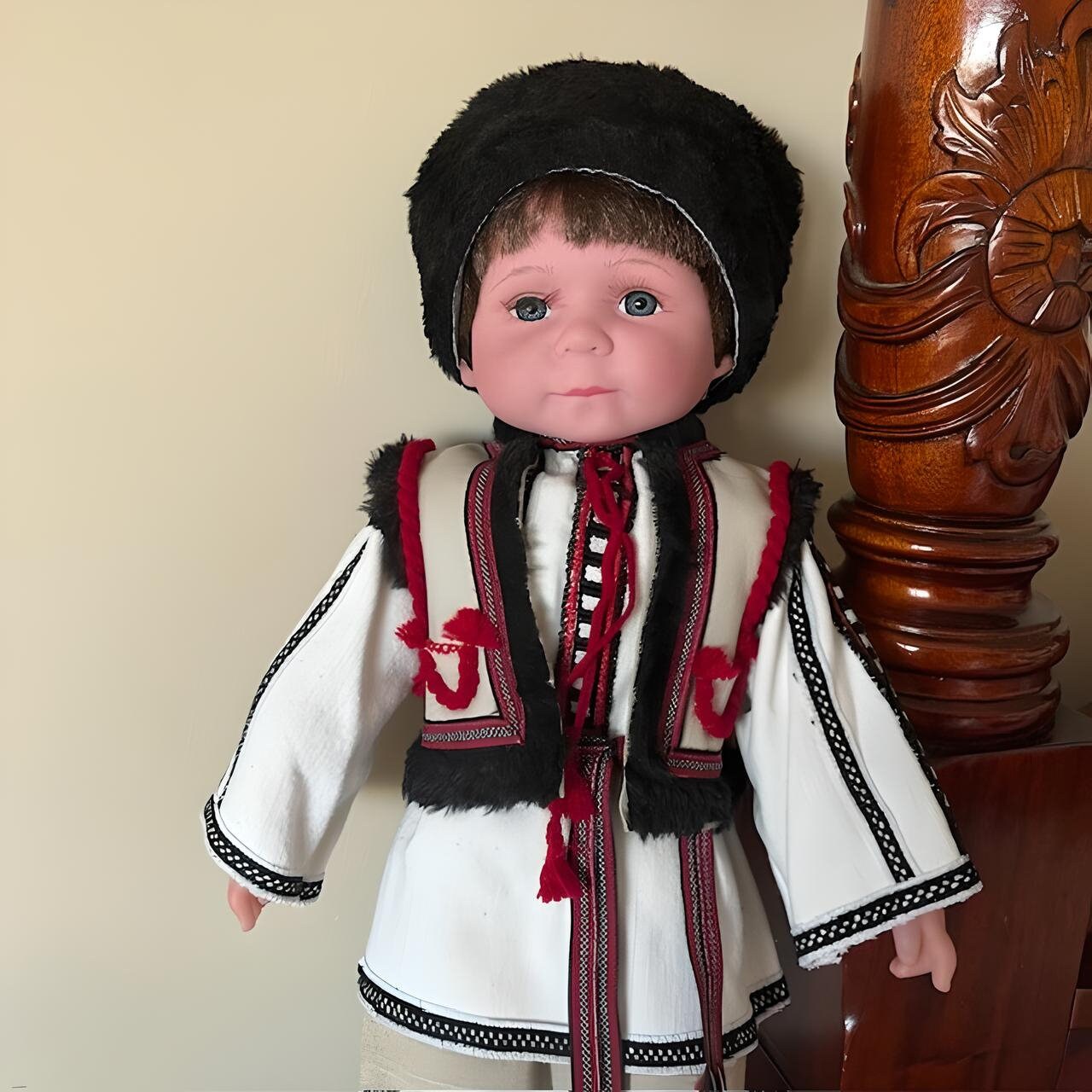 Handmade Ukrainian Boy Doll "Vasyl" in traditional Carpathian outfit with hand-embroidered details and black fur headpiece.