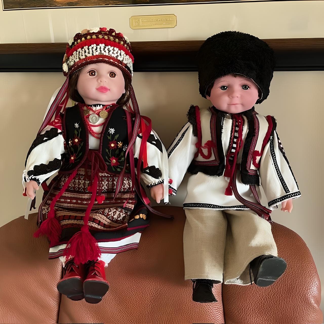 Handmade Ukrainian boy and girl dolls in traditional Carpathian outfits with embroidered details, perfect cultural gifts.