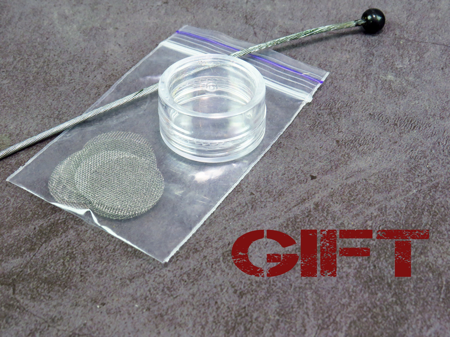 Smoking pipe accessory gift set with screen filters, cleaner, and storage case on gray background.