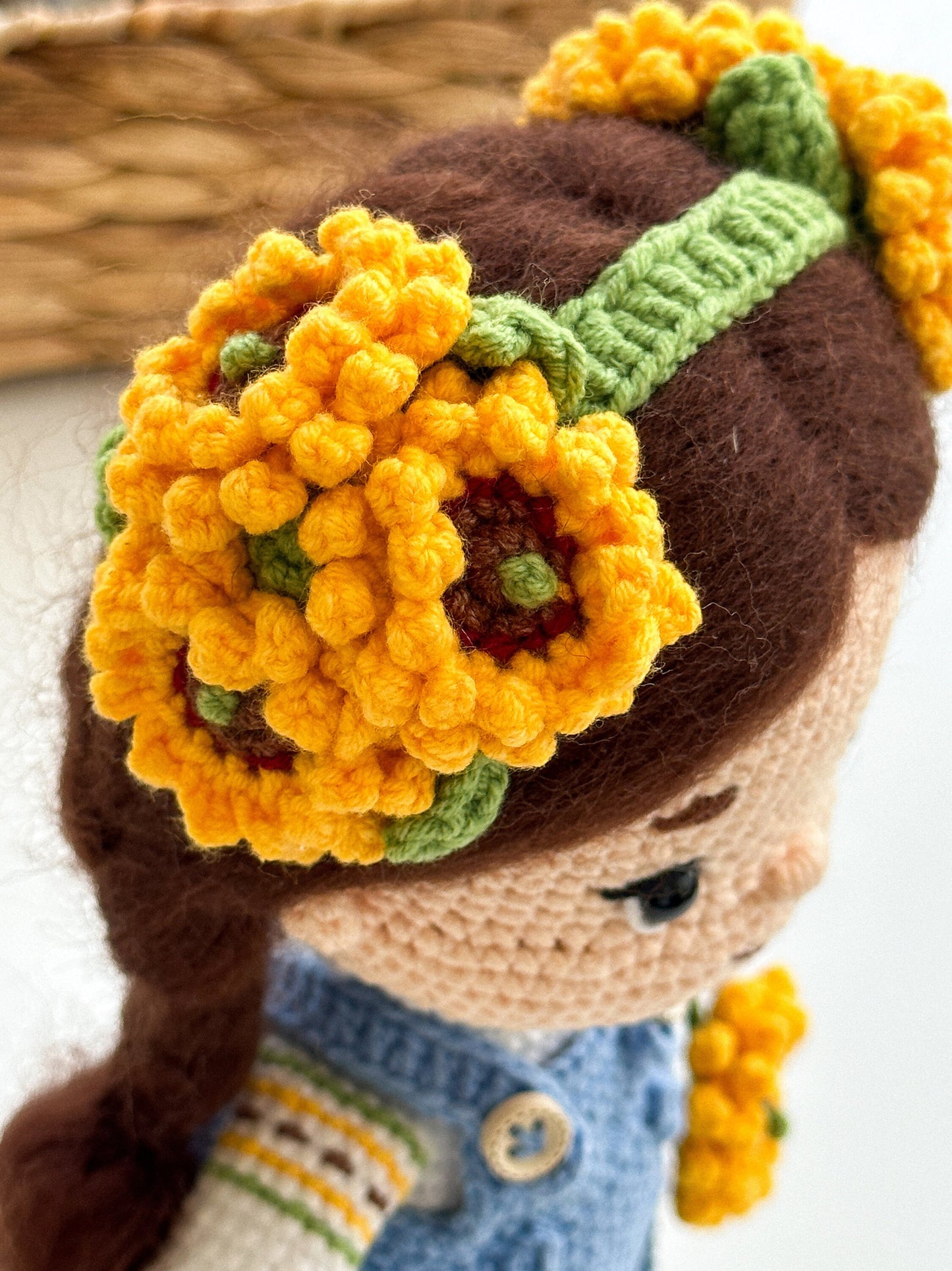 Handmade knitted doll with yellow floral headband, soft Ukrainian themed plush toy, unique cultural keepsake gift.