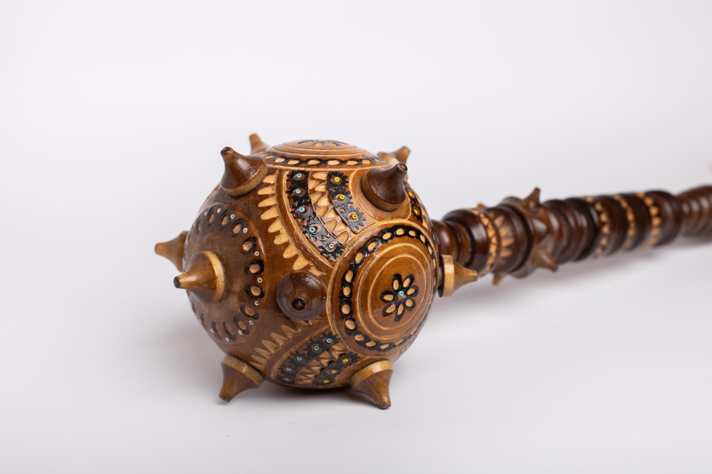 Hand-carved Ukrainian Bulava, wooden mace with intricate designs, symbolizing strength and leadership, perfect gift for men.