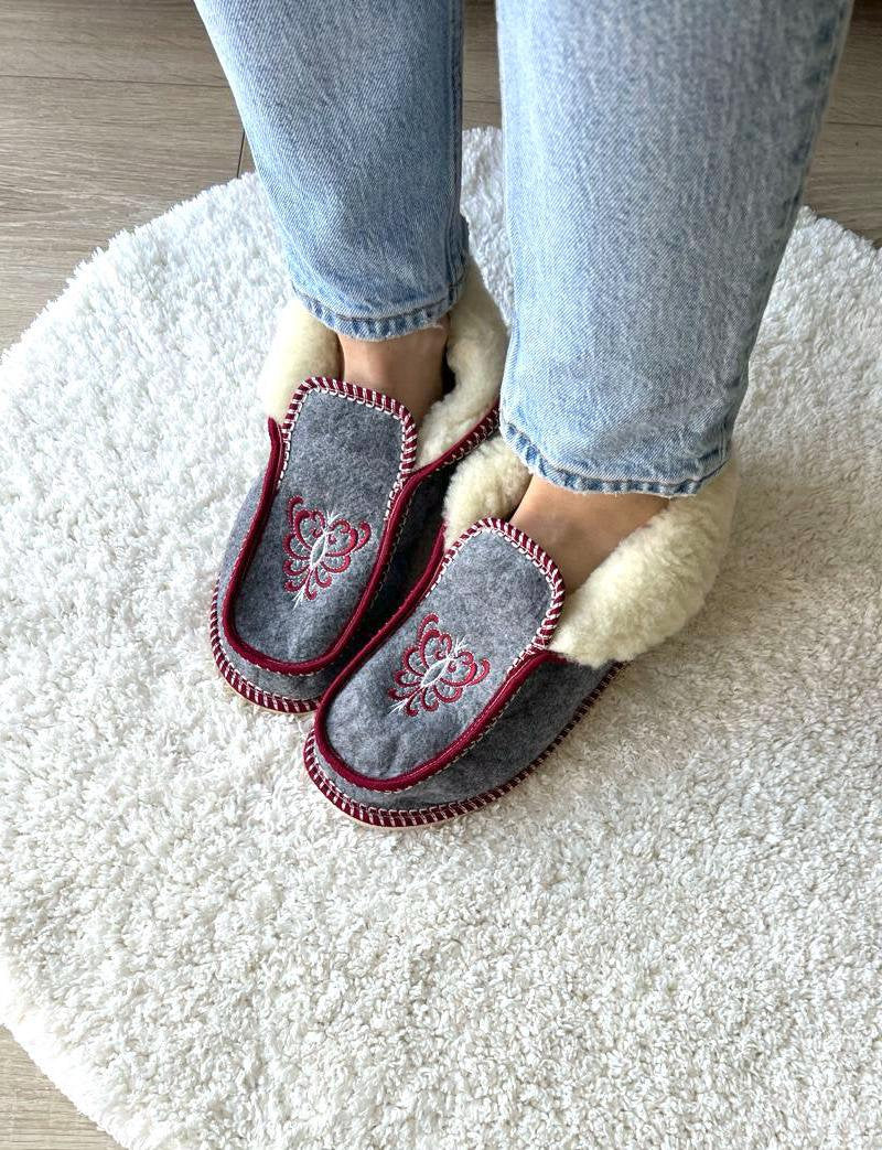 Handmade Carpathian wool slippers with Hutsul embroidery, a cozy and stylish Ukrainian Christmas gift.