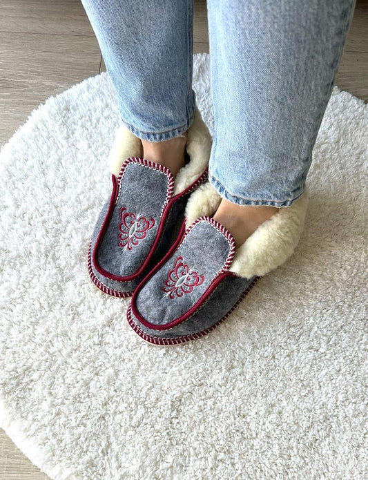 Handmade Carpathian wool slippers with Hutsul embroidery, a cozy and stylish Ukrainian Christmas gift.